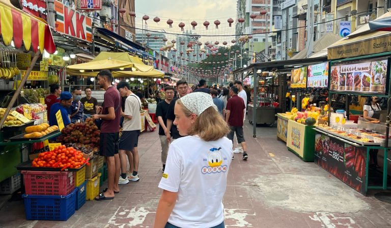Image of vanessa, looking at the many options available on the Jalan Alor food street KL