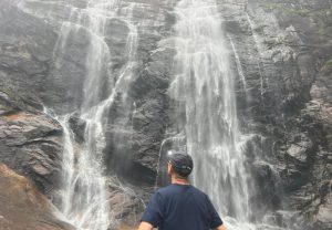 At the bottom of a cascading waterfall. Feeling the spray