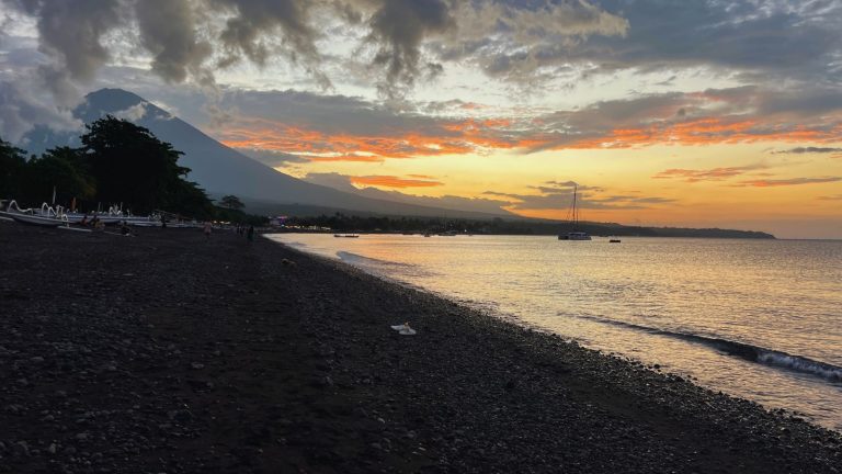 backdrop of the volcano and the beach in amed