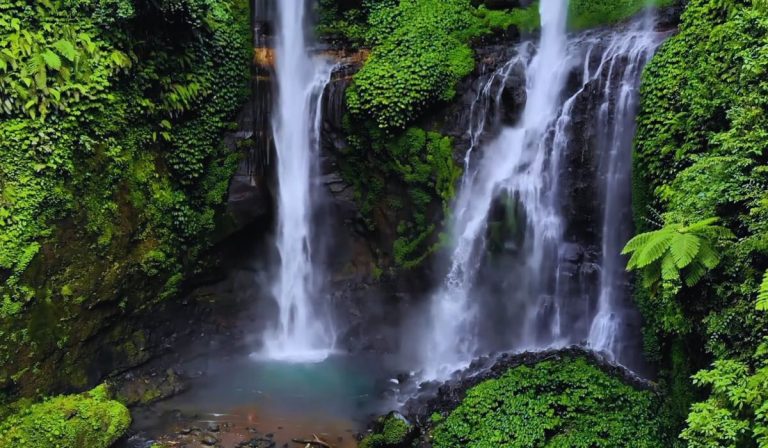 Distant view of the towering Sekumpul Waterfall Bali